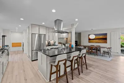 a kitchen with a island with bar stools at 1010 Rosehill Dr in Boulder