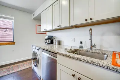 a kitchen with a sink and a dishwasher at half Mi to Dtwn Frisco Mtn-View Condo with Pool! in Frisco
