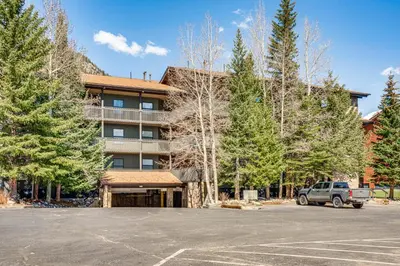 a parking lot in front of a building at half Mi to Dtwn Frisco Mtn-View Condo with Pool! in Frisco