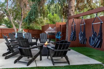 a group of chairs and a table in a yard at Mid Summer Night's Dream w/HotTub&Theater in Arvada