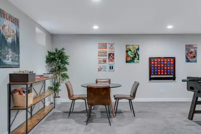a dining room with a table and chairs at Mid Summer Night's Dream w/HotTub&Theater in Arvada