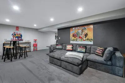 a living room with a couch and a table at Mid Summer Night's Dream w/HotTub&Theater in Arvada