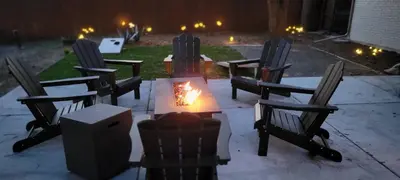 a group of chairs around a fire pit at night at Mid Summer Night's Dream w/HotTub&Theater in Arvada