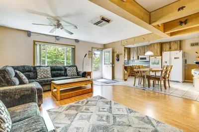 a living room with a couch and a table at Near Family-Friendly Attractions Northglenn Home! in Northglenn