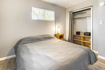 a bedroom with a large bed and a window at Near Family-Friendly Attractions Northglenn Home! in Northglenn