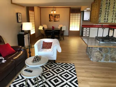 a living room with a couch and a table at Unique Home 40 acres Peaceful Near Boulder 2 Dogs OK in Longmont