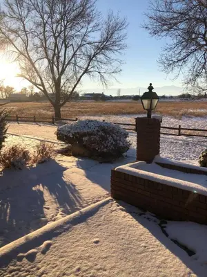 a snow covered yard with a street light and a fence at Large Home Near Boulder Fenced Yard 2 Dogs OK in Longmont