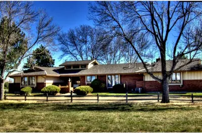 a house with a fence in front of it at Large Home Near Boulder Fenced Yard 2 Dogs OK in Longmont
