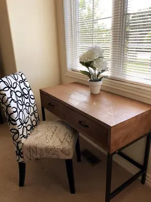 a desk with a chair next to a window with a plant at A Peaceful Slice of Heaven Near Boulder in Niwot