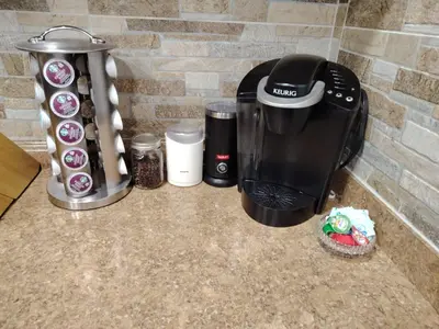 a coffeemaker and coffee maker on a counter at Home with Garden 3BR Perfect Family & Groups in Denver