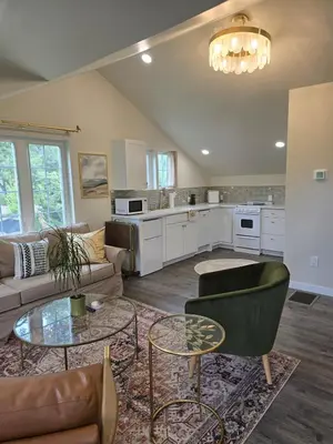 a living room with a couch and a table at Luxury Living in the city in Denver