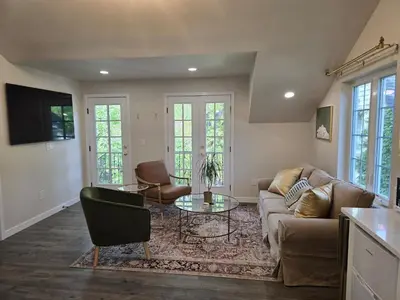 a living room with a couch and a table at Luxury Living in the city in Denver