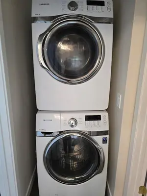 two washing machines and a washer and dryer in a room at Luxury Living in the city in Denver