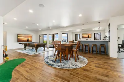 a dining room and living room with a pool table at Bridle Ridge Retreat - Modern Comfort, Open Views in Timnath
