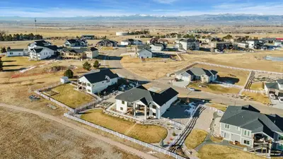 an aerial view of a residential neighborhood with houses at Bridle Ridge Retreat - Modern Comfort, Open Views in Timnath