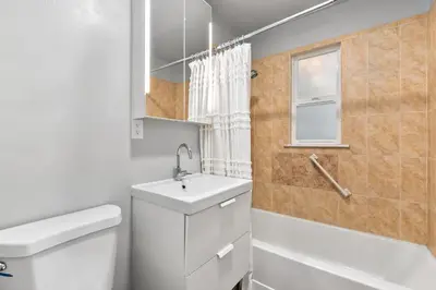 a bathroom with a sink and a toilet and a shower at Urban Nest - Garage, Sunroom & Fenced Yard in Fort Collins
