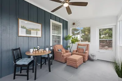 a dining room with a table and chairs and a ceiling fan at Wright House - Country Retreat with Spa, EV & Garage in Loveland