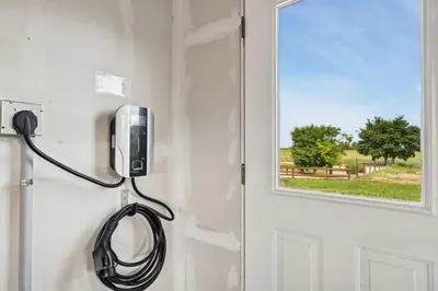 a phone hanging on a wall next to a door at Wright House - Country Retreat with Spa, EV & Garage in Loveland