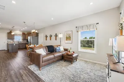 a living room with a couch and a table at Wright House - Country Retreat with Spa, EV & Garage in Loveland