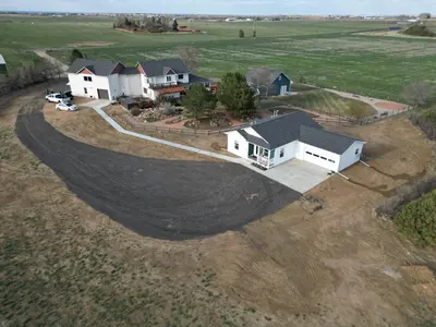an aerial view of a house in a field at Wright House - Country Retreat with Spa, EV & Garage in Loveland