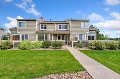 a house with a lawn in front of it at Parkside Retreat - 2 Suites, Office, Garage in Fort Collins