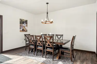 a dining room with a table and chairs at 4br Mountain View Home - 5 Minutes To Granby Ranch in Granby