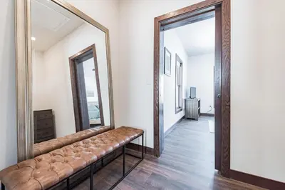 a living room with a large mirror and a couch at 4br Mountain View Home - 5 Minutes To Granby Ranch in Granby