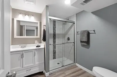 a bathroom with a shower and a sink at Arvada Retreat + 6 BD + Movie Theater in Arvada