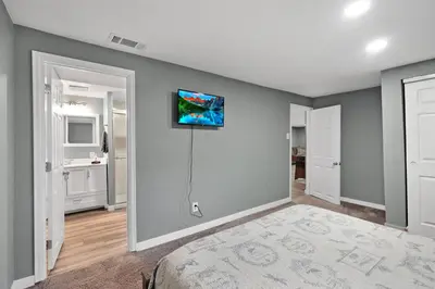 a bedroom with a wall with a tv on it at Arvada Retreat + 6 BD + Movie Theater in Arvada