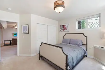 a bedroom with a bed and a window at HUGE Downtown Getaway! w/Hot Tub in Arvada
