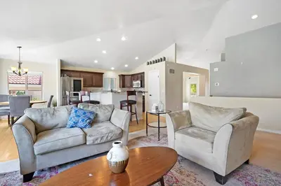 a living room with two couches and a table at HUGE Downtown Getaway! w/Hot Tub in Arvada