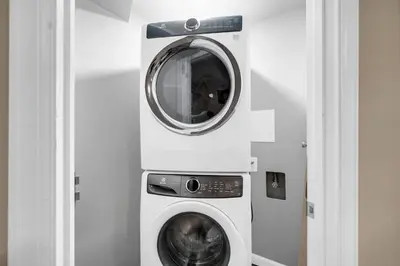 a washing machine and a dryer in a room at Huge Arvada Retreat! Quiet Area in Arvada