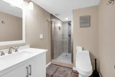 a bathroom with a toilet and a sink and a shower at Huge Arvada Retreat! Quiet Area in Arvada