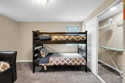 a bedroom with bunk beds in a room at Huge Arvada Retreat! Quiet Area in Arvada