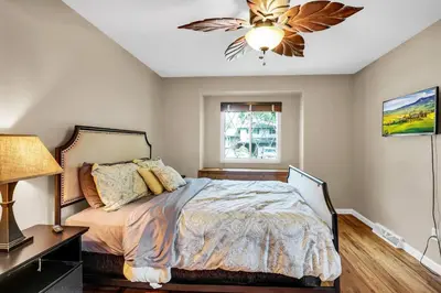 a bedroom with a bed and a ceiling fan at Huge Arvada Retreat! Quiet Area in Arvada
