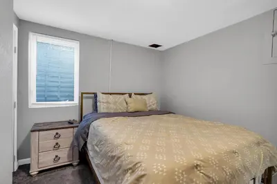 a bedroom with a bed and a window at Huge Arvada Retreat! Quiet Area in Arvada