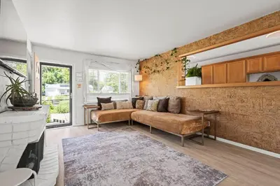a living room with a couch and a fireplace at Heated Pool BBQ Cabana Gardens in Denver