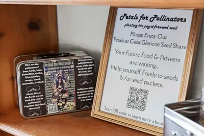 a sign next to a suitcase on a shelf at Heated Pool BBQ Cabana Gardens in Denver