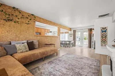 a living room with a couch and a table at Heated Pool BBQ Cabana Gardens in Denver