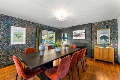 a dining room with a table and chairs at Theater, Hot Tub, Mini Golf, Luxe Fun House in Centennial