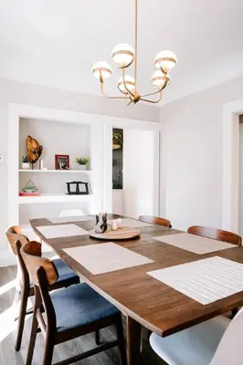 a dining room with a wooden table and chairs at Olde Town Ambler A Distinctive Walkable Retreat in Arvada