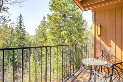 a patio with a table and chairs on a balcony at 2 Mi to Winter Park Resort Mtn-View Haven! in Winter Park