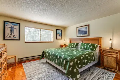 a bedroom with a bed and a dresser in it at 2 Mi to Winter Park Resort Mtn-View Haven! in Winter Park