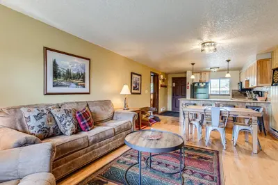 a living room with a couch and a table at 2 Mi to Winter Park Resort Mtn-View Haven! in Winter Park
