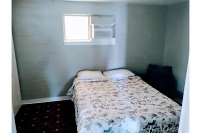 a bed in a small room with a window at Hotel O Englewood-South Denver CO in Englewood