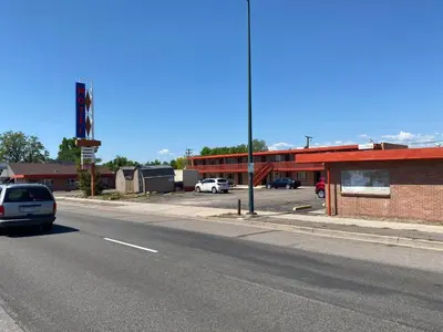 a car parked on the side of a street at Hotel O Englewood-South Denver CO in Englewood