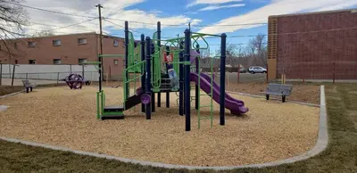 a playground with a slide in a park at West Denver Home 8 Beds! Game Room in Lakewood