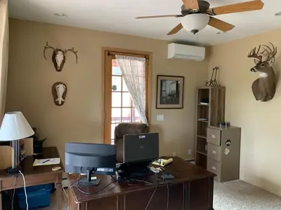 an office with a desk with a computer and a ceiling fan at Your Mountain Retreat in Loveland