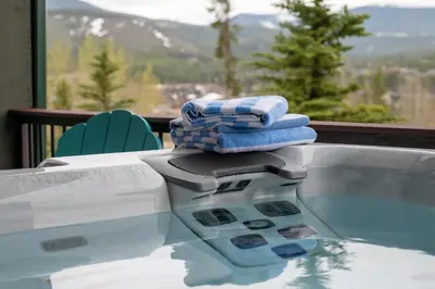 a pile of towels sitting on top of a hot tub at 130 Discovery Court at Rendezvous home in Fraser