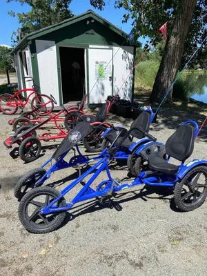 a group of tricycles parked in a parking lot at The Urban Roost I A Rustic City Escape in Denver